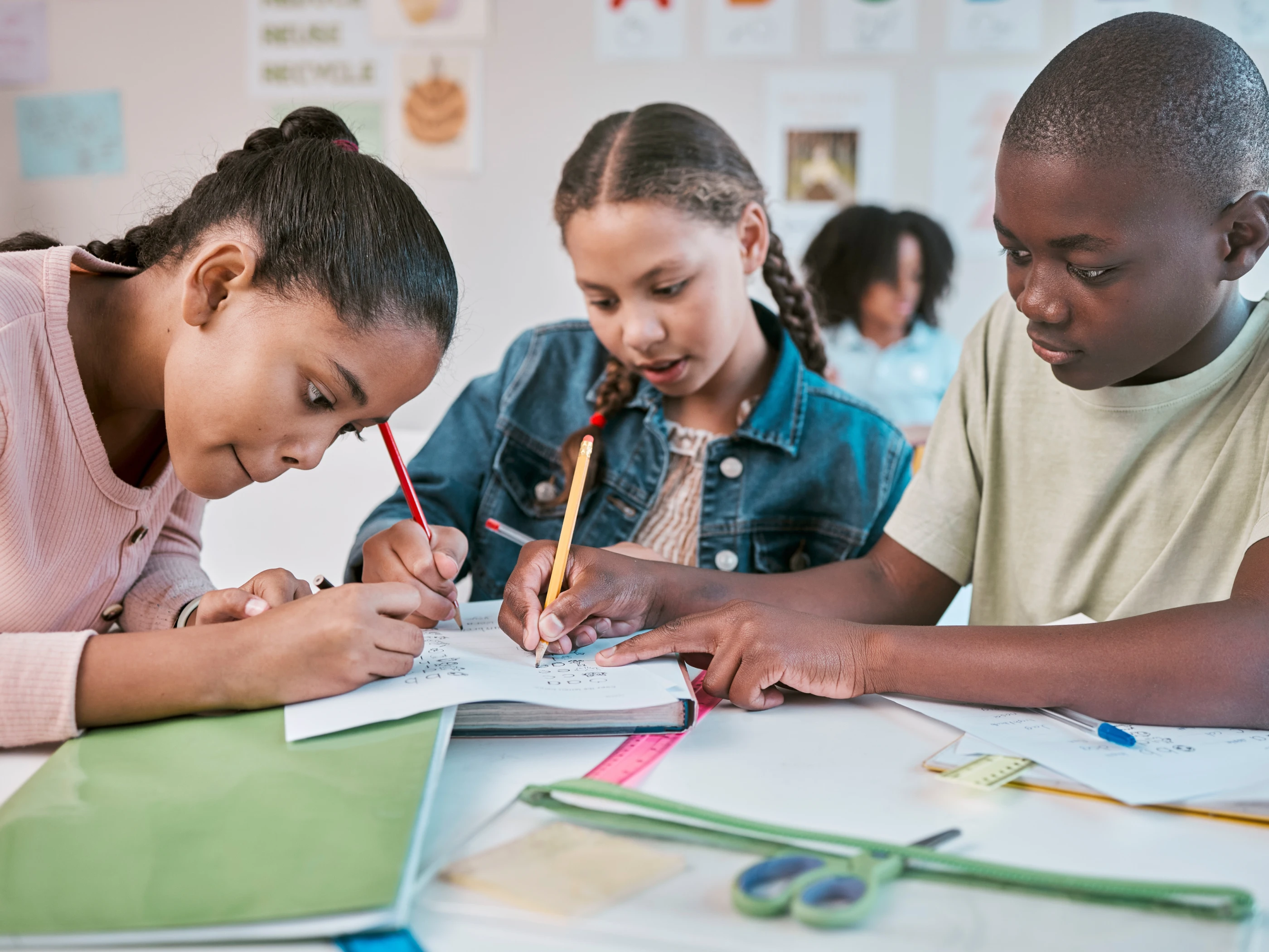 Group of students doing bookwork.